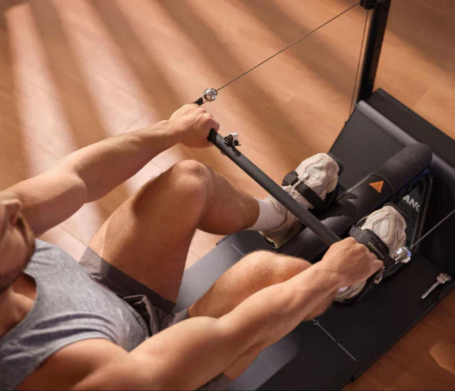 Man using Speediance Gym Monster 2 for rowing