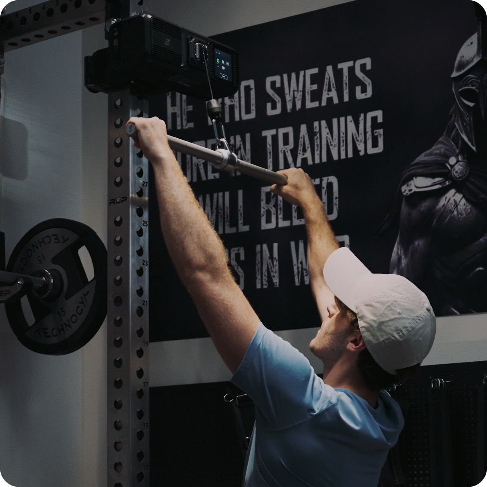 Athlete using Gym Nano cable range